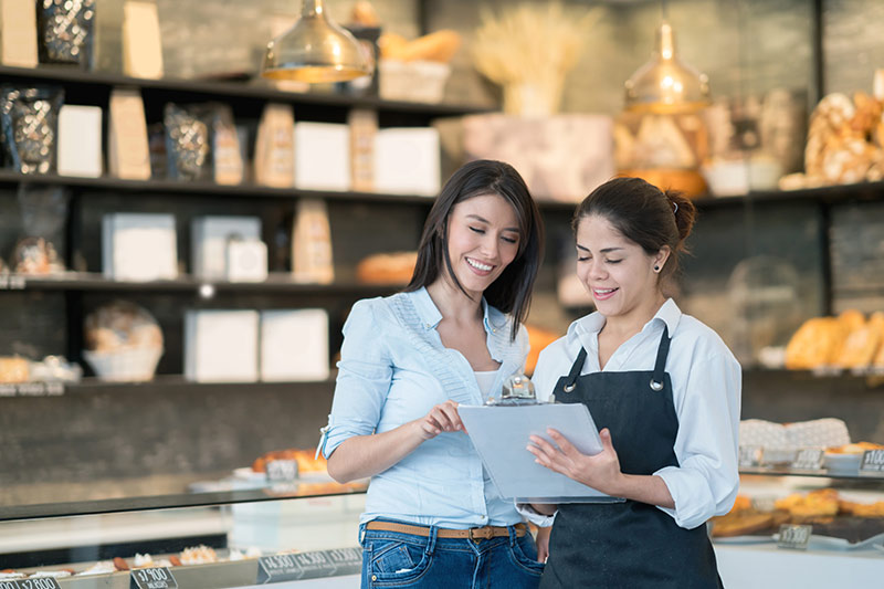 two female employees at a bakery