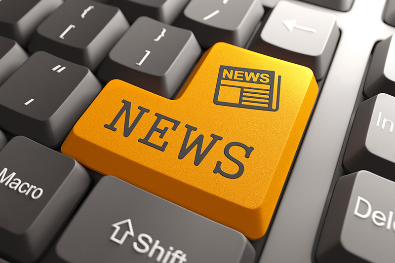 computer keyboard with a large key that says news