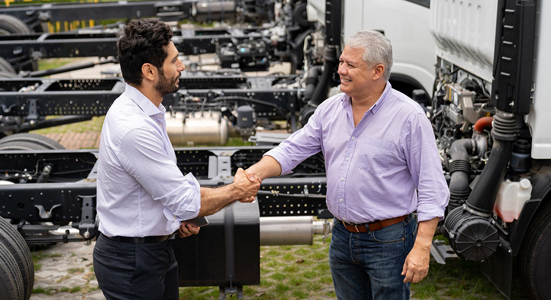 group of smiling small business owners and employees in front of a store, senate bill provides tax relief for businesses